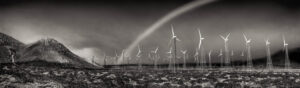 A black and white photo of wind turbines