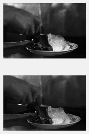 A person is cutting food on a plate.