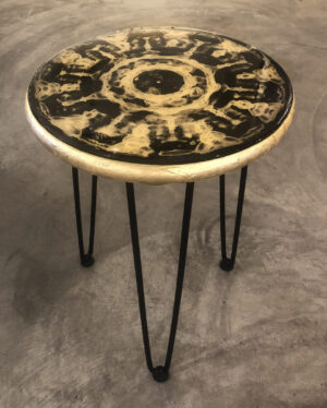 A black and white table with metal legs.