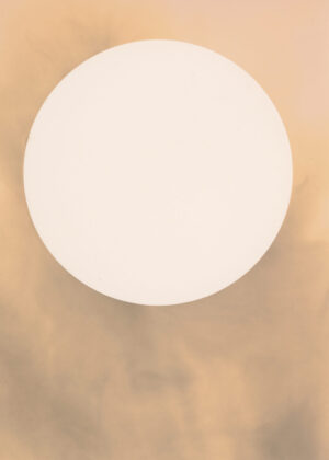A white sun is seen in the sky.