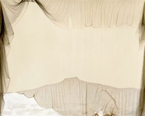 A white sheet with some brown fabric on it