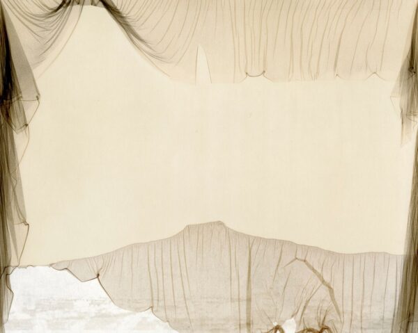 A white sheet with some brown fabric on it