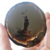 A person holding an object in their hand.