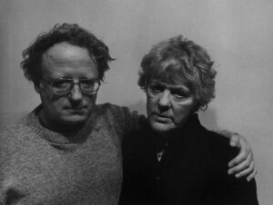 A man and woman standing next to each other.