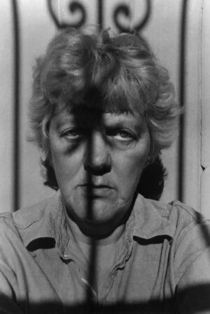 A black and white photo of an older woman