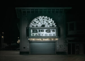 A large building with lights on top of it.