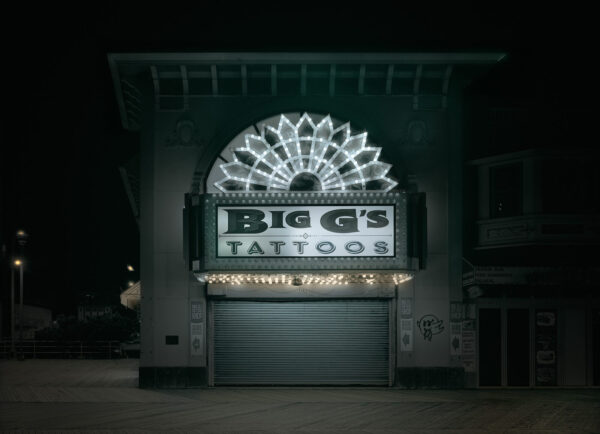 A large building with lights on top of it.