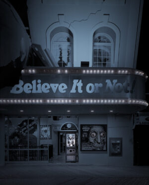 A theater with lights on the front of it.