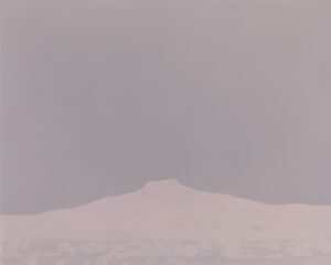 A mountain in the distance with a sky background