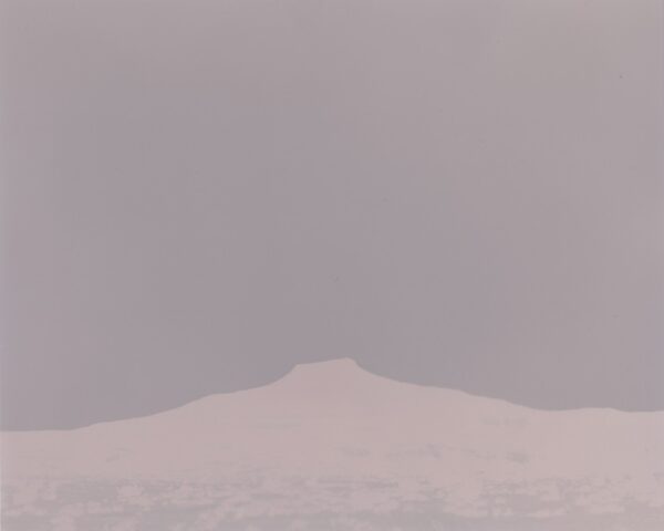 A mountain in the distance with a sky background