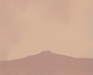 A mountain with a sky background