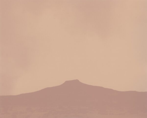 A mountain with a sky background