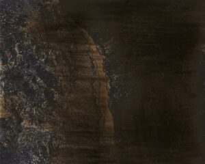 A dark picture of the side of a mountain.