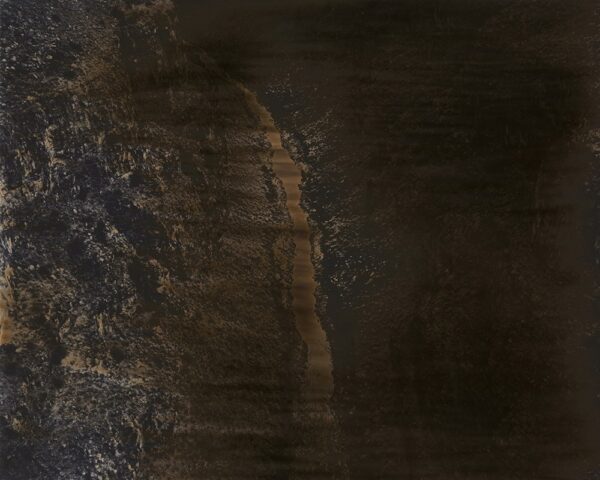 A dark picture of the side of a mountain.