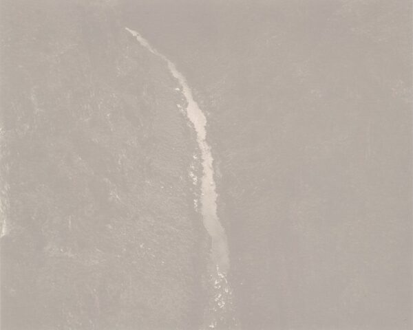 A white streak of light is seen in the sky.