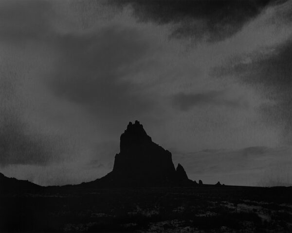 A black and white photo of some mountains