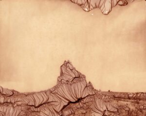 A brown and white photo of some mountains