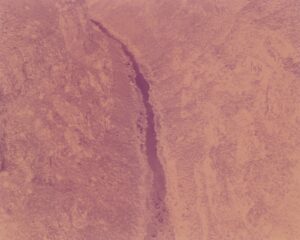 A pink background with a small waterfall in the middle.