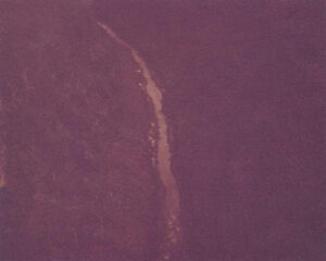 A purple background with a long line of water.