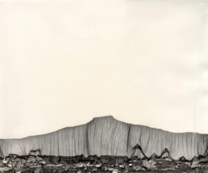 A black and white photo of a mountain range.