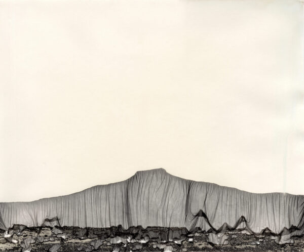A black and white photo of a mountain range.