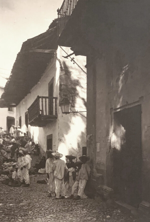 A group of people standing outside of a building.