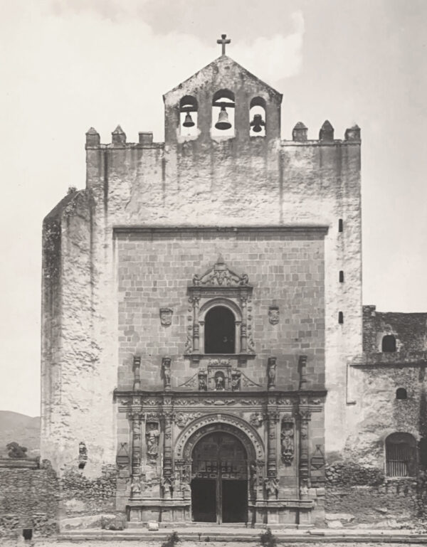 A black and white photo of an old church.