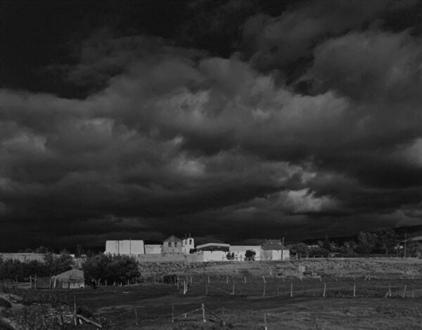 A black and white photo of a cloudy sky