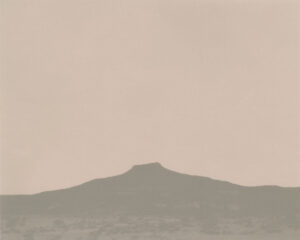A mountain in the distance with a sky background