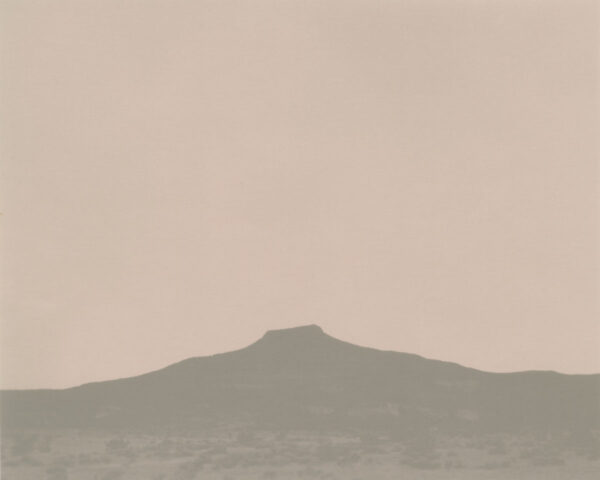A mountain in the distance with a sky background