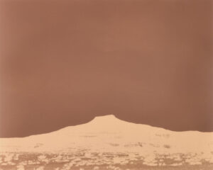 A mountain with snow on it's top.