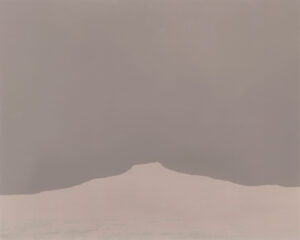 A mountain in the distance with a sky background