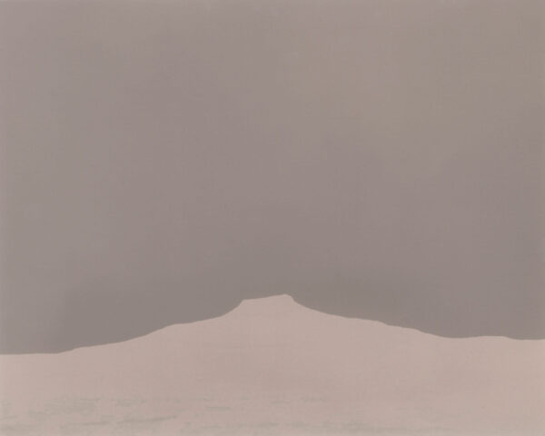 A mountain in the distance with a sky background