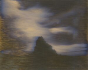 A painting of a mountain with dark clouds in the background.