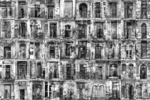 A black and white photo of many windows.