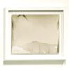 A white frame with a picture of mountains in it.