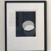 A black and white photo of an object in a frame.