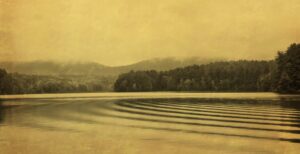 A painting of a lake with trees in the background