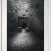 A black and white photo of an old brick building.