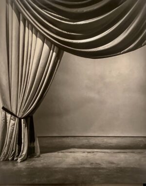 A room with a curtain and a floor