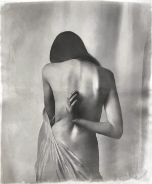 A woman with her back turned to the camera.