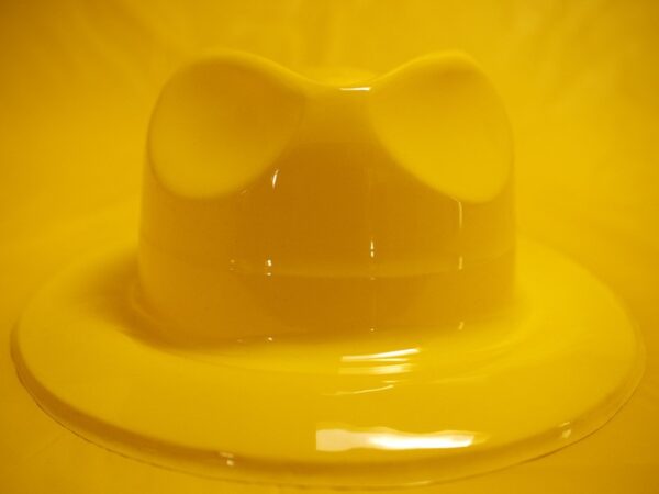 A yellow bowl with a bow on top of it.