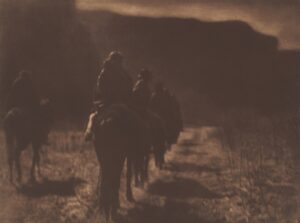 A group of people riding on the back of horses.