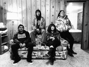 A group of people sitting on top of a couch.