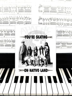 A card sitting on top of a piano keyboard.