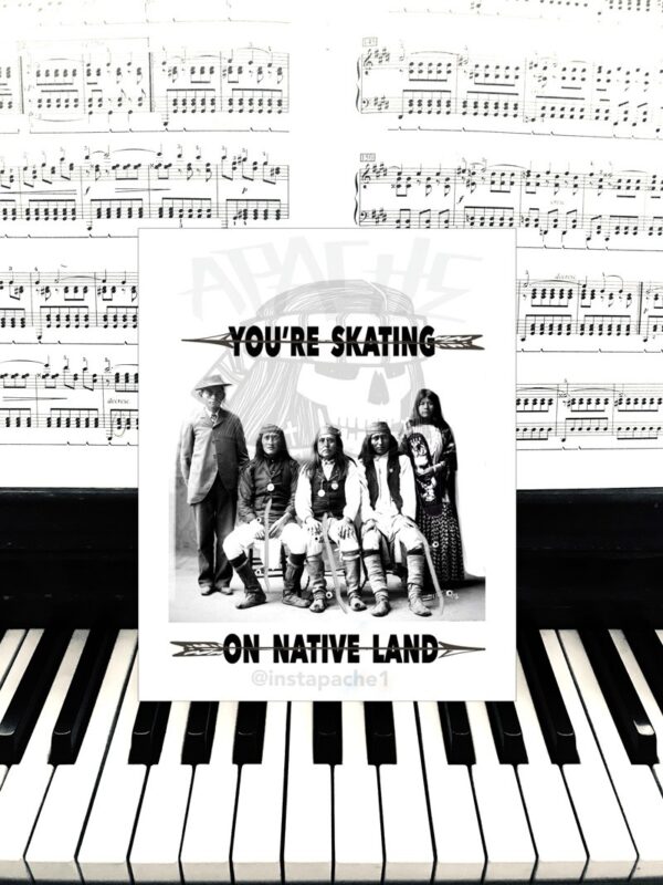 A card sitting on top of a piano keyboard.