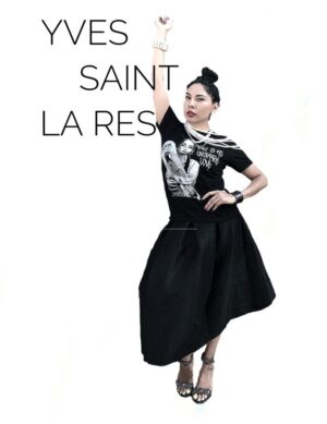 A woman in black shirt and skirt holding up her hand.