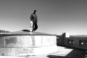 A man standing on top of a building.