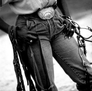 A person with chains on their legs and belt.