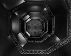 A black and white photo of an empty staircase.